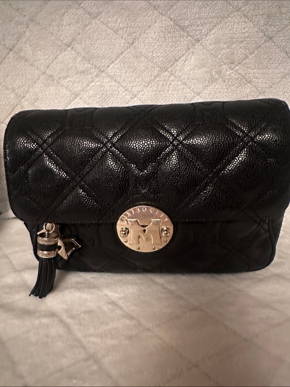Black Quilted Crossbody Bag with Gold-Tone Medallion